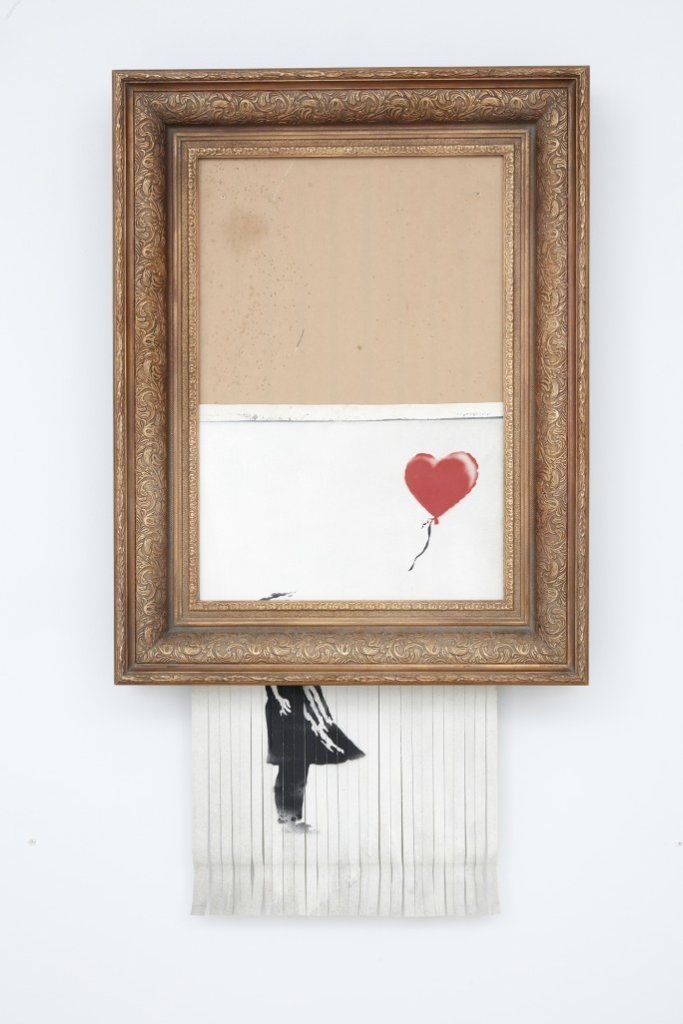 最新班克斯藝術作品「愛在垃圾箱裡」在拍賣會上現場創作